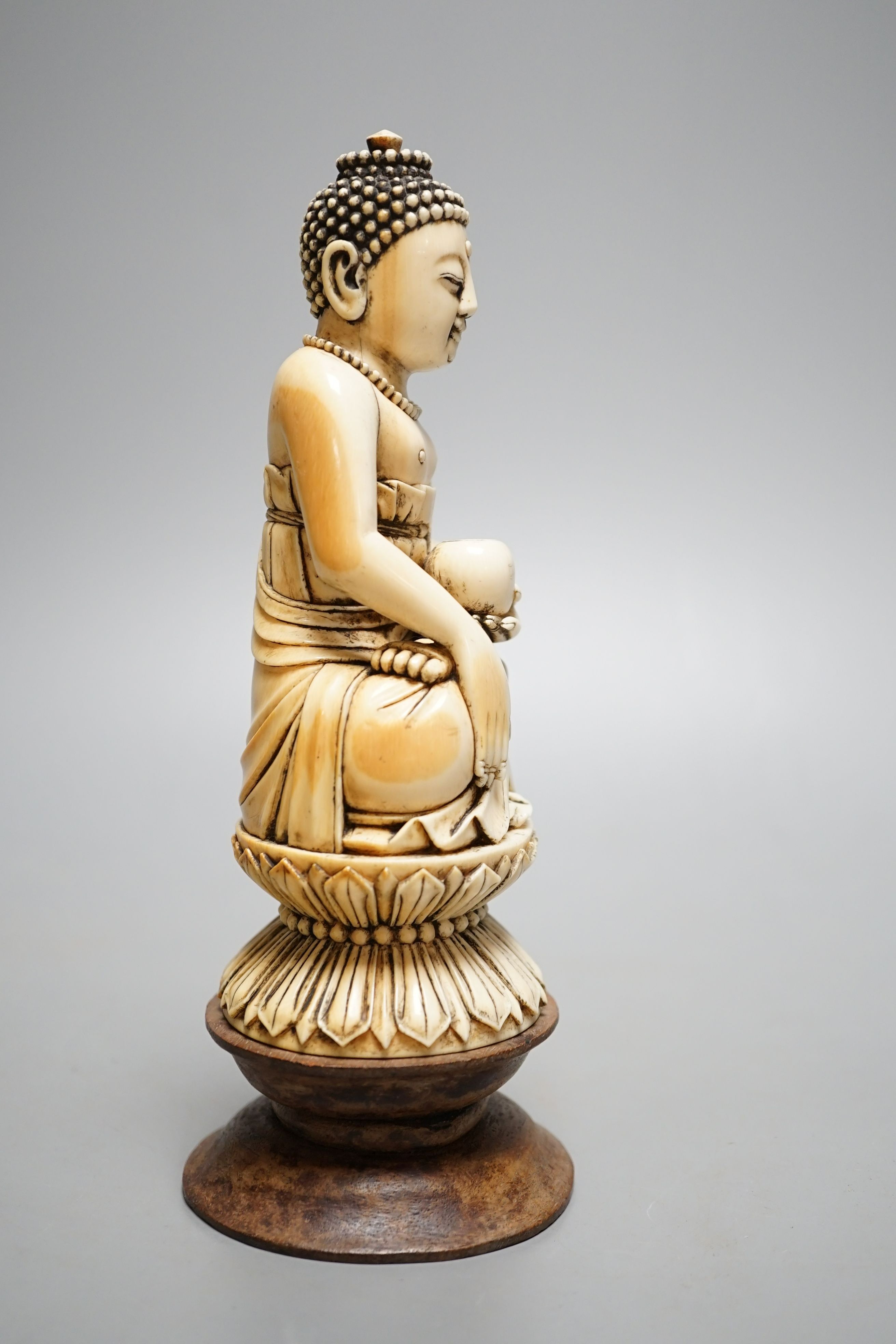 A 19th century Chinese ivory seated figure of Buddha Shakyamuni - 19cm tall